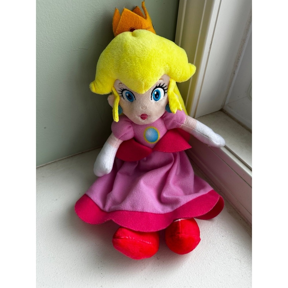 Plush doll of Princess Peach from the Nintendo Super Mario